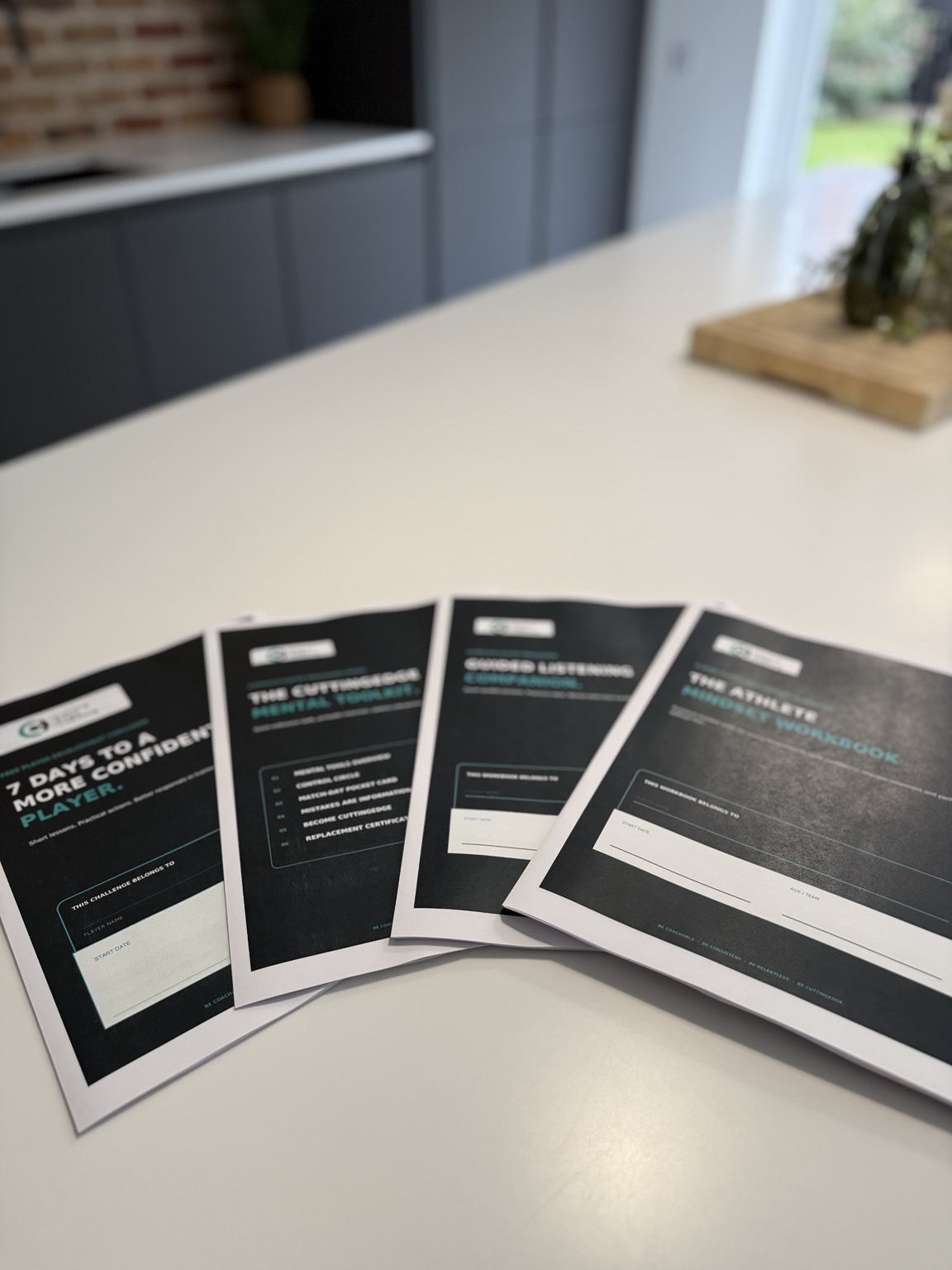 CuttingEdge athlete development workbooks arranged ready for use